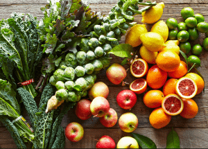 a group of fruits and vegetables on a wood surface Healthy Weight Loss Diets Biggleswade