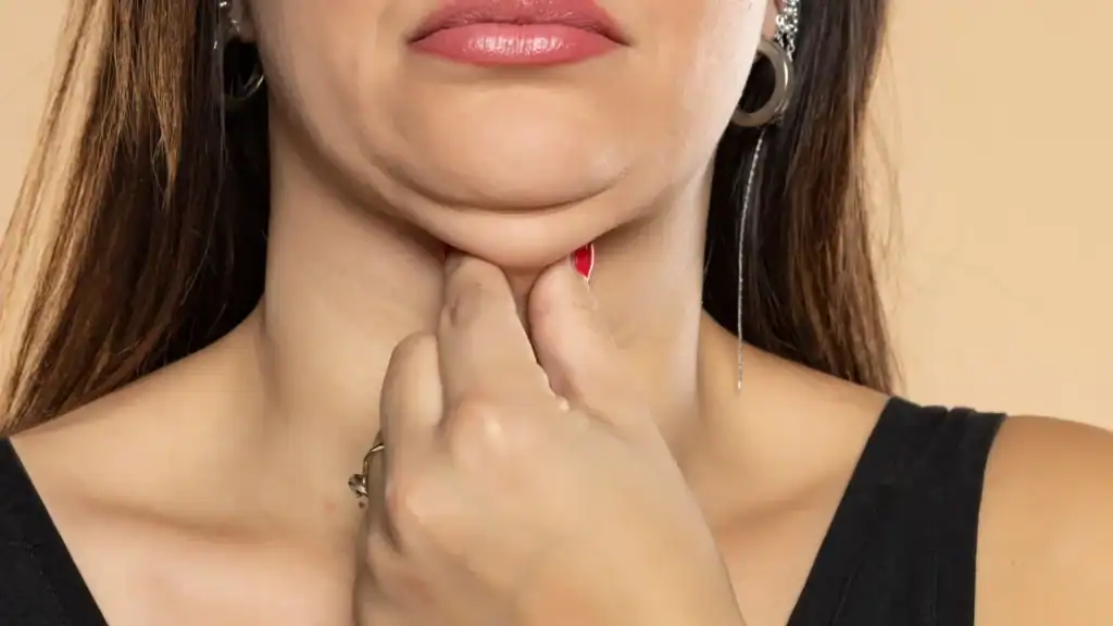 An image of a woman with double chin, sad, worried : Non Surgical Double Chin Removal Treatment in Biggleswade, UK